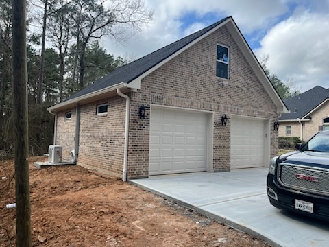 Henry’s Garage: 4-Car Garage with AC, Epoxy Floors & Walk-Up Attic